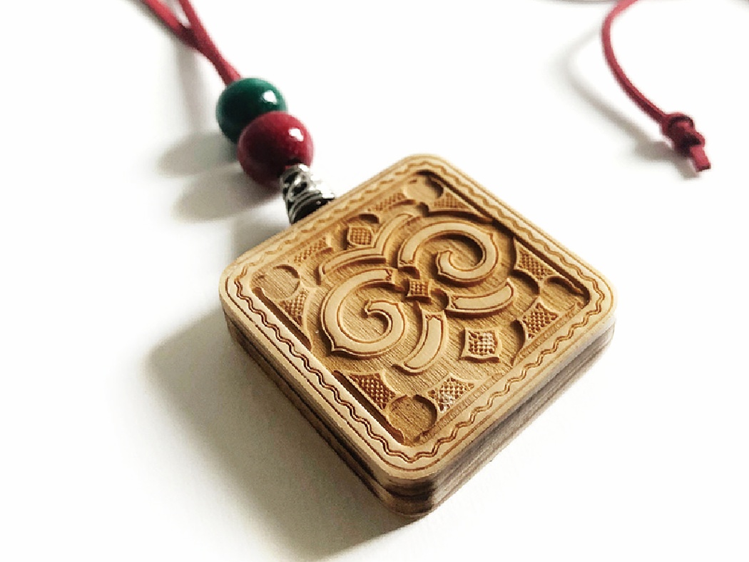 Pendant with Ainu pattern
